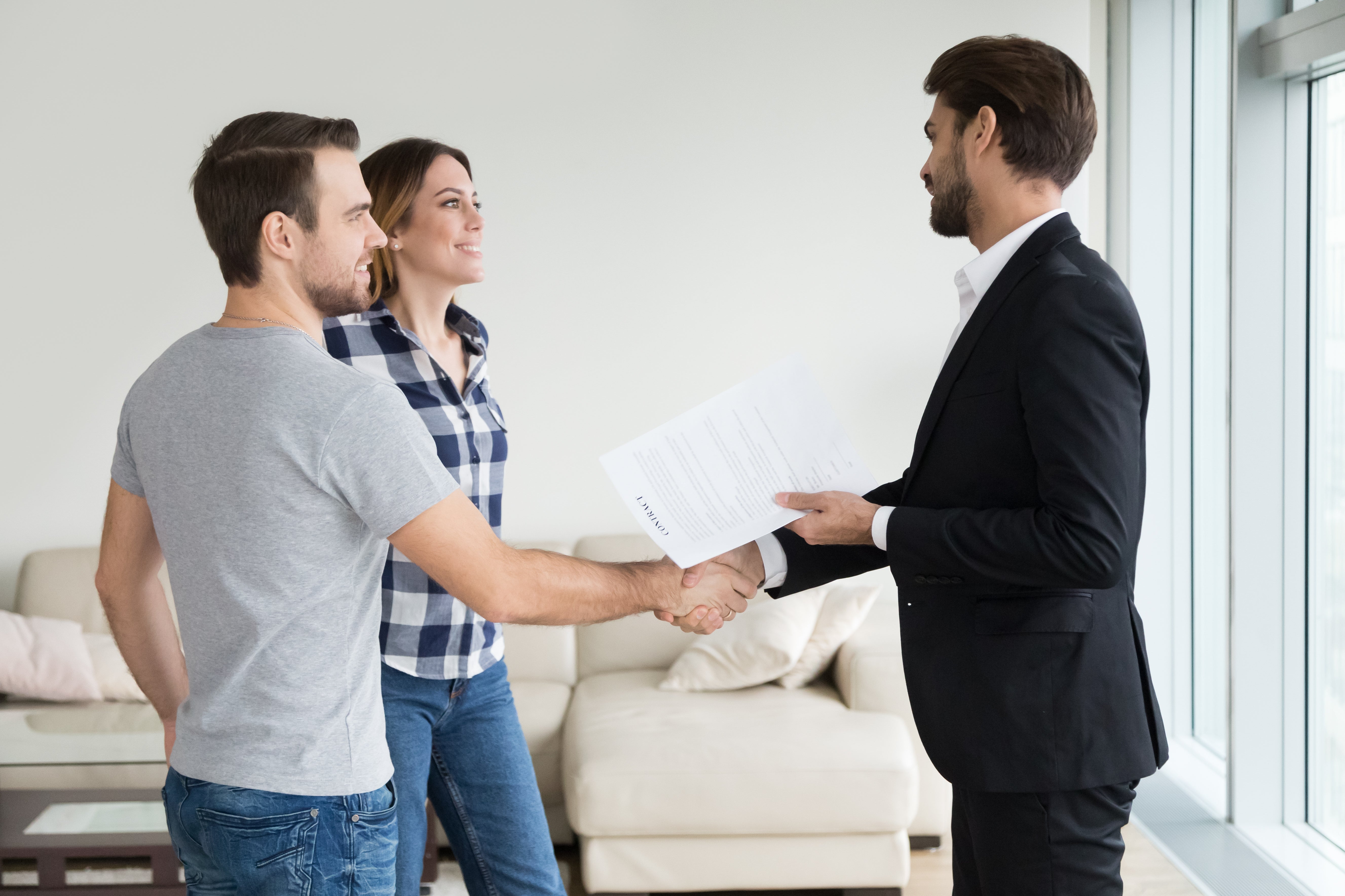 couple conversing with a man