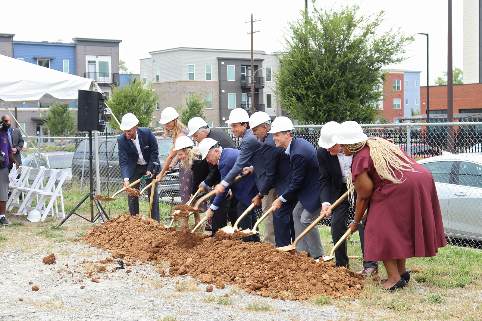 A group of people holding shovels during a ground breaking ceremony.