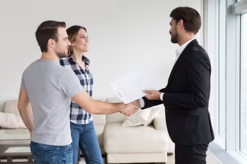 couple conversing with a man